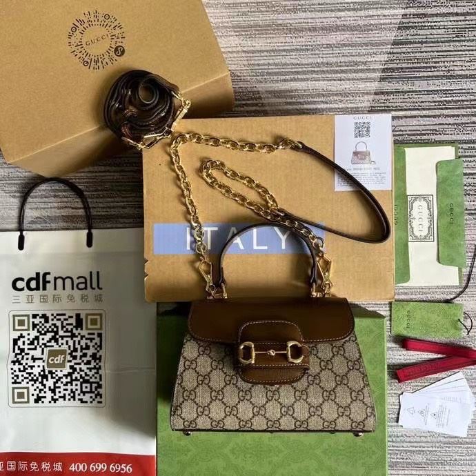 G*u*i top handle bags